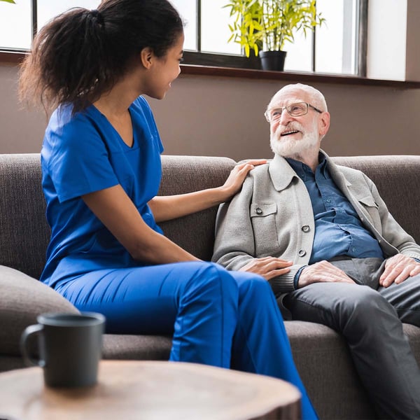 A nurse talks with a resident